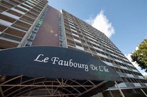 Gatineau apartment for rent - a tall building with a black sign in front of it