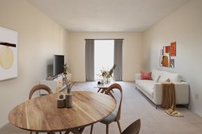 Kingston apartment for rent - A modern dining room with a wooden table and chairs.