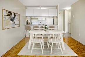 Ottawa apartment for rent - A dining room with a white table and chairs.