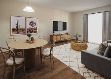 Kingston apartment for rent - A living room with a round table surrounded by chairs and a flat screen TV mounted on the wall.