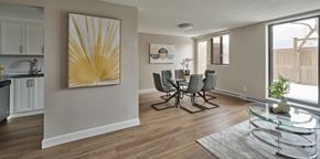 Ottawa apartment for rent - A dining room with a glass table and chairs.