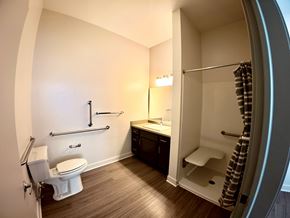 Indianapolis apartment for rent - A bathroom with a toilet, sink, and shower.