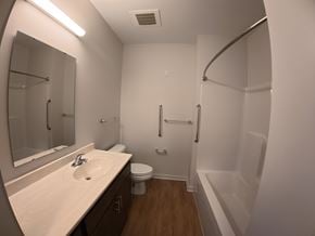 Indianapolis apartment for rent - A bathroom with a sink, toilet, and bathtub.