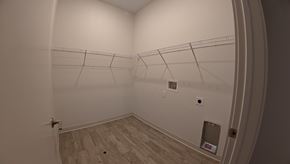 Indianapolis apartment for rent - A room with a white wall and a wooden floor.