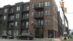 Indianapolis apartment for rent - A black car is parked in front of a building.