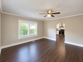 Anderson house for rent - A room with a ceiling fan and wooden flooring.