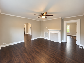 Anderson house for rent - A room with a fireplace and wood flooring.