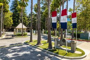 Walnut Creek apartment for rent - a park with flags and trees and a fountain