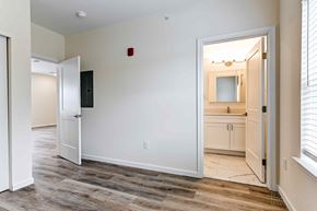 Philadelphia apartment for rent - A room with a white door and a white wall with a red light switch.