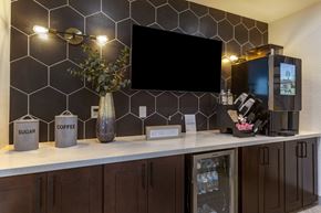 Phoenix apartment for rent - a kitchen with a counter and a tv on the wall