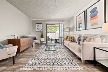 Tempe apartment for rent - a living room with a white couch and a glass table
