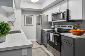 Glendale apartment for rent - a kitchen with white cabinets and stainless steel appliances