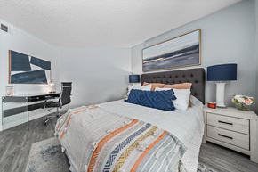 Glendale apartment for rent - a bedroom with a bed and desk in a 555 waverly unit