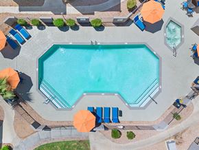 Glendale apartment for rent - an aerial view of a swimming pool with umbrellas and chairs