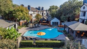 Lewisville apartment for rent - a backyard with a swimming pool and a house