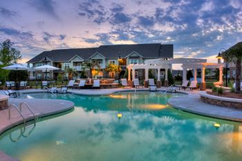 Resort-inspired swimming pool with sundeck