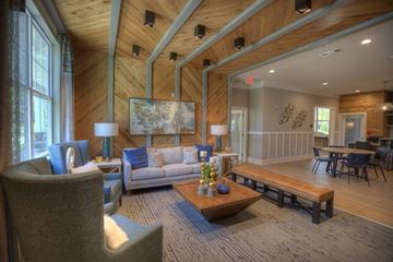 Hixson apartment for rent - A living room with a grey couch and a wooden coffee table.