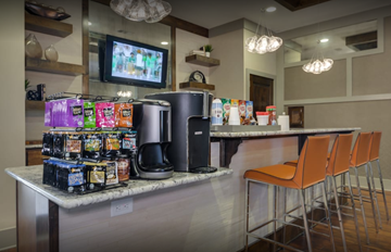 Evans apartment for rent - A kitchen counter with a variety of snacks and drinks on it.