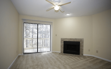Morrow apartment for rent - A room with a fireplace and a ceiling fan.