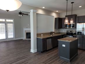 Gray townhouse for rent - Woodland Springs Townhomes | Entertaining Kitchens w/ Stainless Steel Appliances