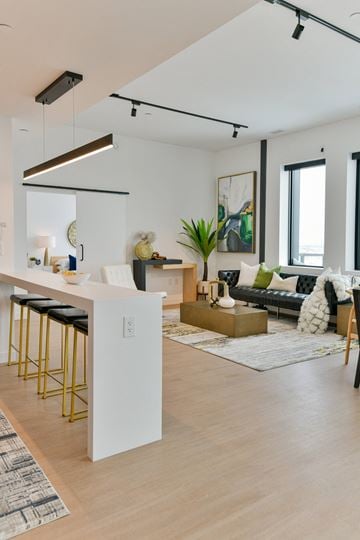 Winnipeg apartment for rent - a living area with a kitchen and a living room with a couch