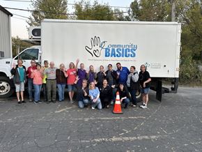 Willmar apartment for rent - A group of people are standing in front of a Community Basics truck.