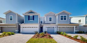 St. Cloud townhouse for rent - A row of houses with garages in front.