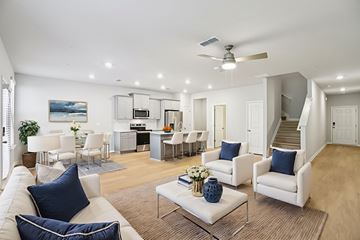 Hampton townhouse for rent - A living room with white furniture and a painting on the wall.