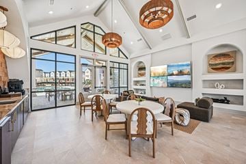 Canton townhouse for rent - A modern dining room with a large table and chairs.