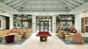 Parrish triplex for rent - A room with a pool table and couches.