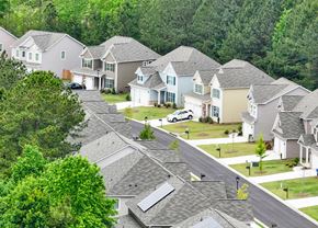 Dallas apartment for rent - A suburban neighborhood with houses and trees.