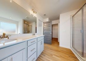 Covington apartment for rent - A bathroom with a sink and a mirror.