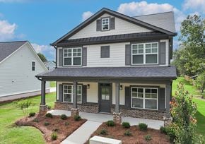 Covington apartment for rent - A house with a grey roof and a small front yard.