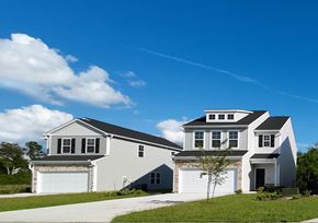Leland apartment for rent - A two-story house with a garage on the ground floor and a living area on the upper floor.