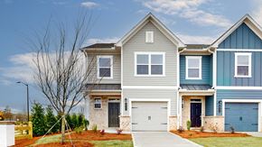 Covington townhouse for rent - A row of houses with garages in front.