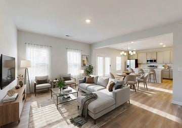 Mcdonough apartment for rent - A modern living room with a grey sofa set and a television.