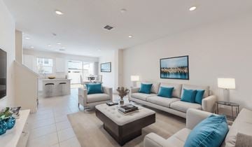 St. Cloud townhouse for rent - A living room with a white couch and a coffee table.