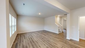 Troutman apartment for rent - A spacious room with wooden floors and white walls.