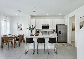 St. Cloud townhouse for rent - A modern kitchen with a dining table and chairs.