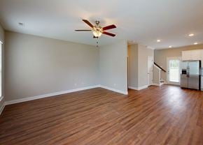 Chattanooga townhouse for rent - A room with a ceiling fan and wooden flooring.