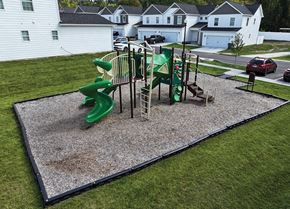 Chattanooga townhouse for rent - A playground with a green slide and a climbing structure.