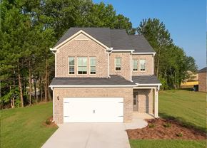 Conyers apartment for rent - A two-story house with a garage and a driveway.