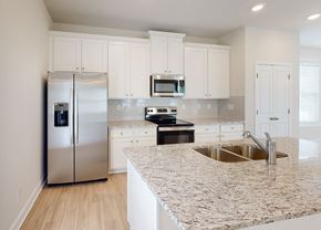 Conyers apartment for rent - A kitchen with a granite countertop and stainless steel appliances.