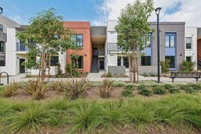 Los Angeles apartment for rent - A modern building with a landscaped front yard.
