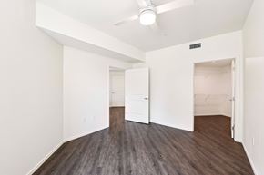 Los Angeles apartment for rent - A room with a ceiling fan and wood flooring.