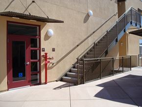 South San Francisco apartment for rent - the front entrance of a building with a staircase and a red door