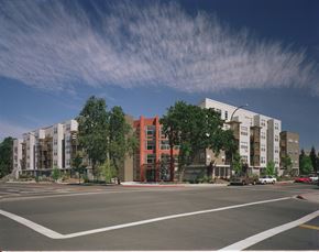 Walnut Creek apartment for rent - a rendering of an apartment building on a city street