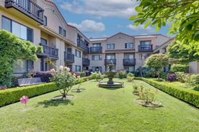 South San Francisco apartment for rent - a yard with a fountain in the middle of some apartments