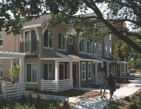 Santa Rosa apartment for rent - a man and a woman walking down a sidewalk in front of houses