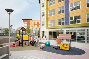 San Diego apartment for rent - a childrens play area in the courtyard of an apartment building